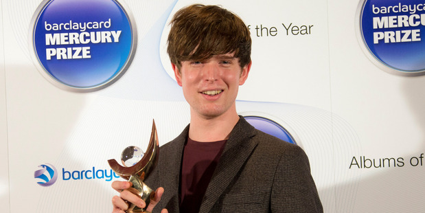 British musician James Blake smiles after winning the Mercury Prize 2013 award in London. Photo / AP