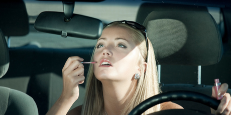 Applying makeup means your eye is not on the road. Photo / Getty Images
