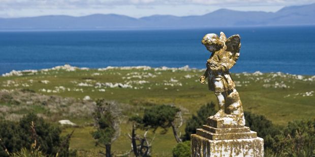 The Old Bluff Cemetery is in a striking location, straddling a hill that overlooks Bluff Harbour and town on one side and Foveaux Strait and Stewart Island on the other. Photo / Chris Samsara