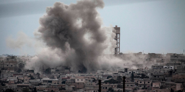 Smoke rises from buildings from an airstrike that hit Habit village, in the Syrian central province of Hama on Sept 22. Photo / AP