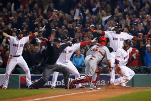 St Louis catcher Yadier Molina looks back as home plate umpire Jim Joyce calls Boston's Jonny Gomes safe. Photo / AP