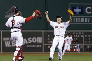 Boston Red Sox relief pitcher Koji Uehara and catcher David Ross celebrate after getting St. Louis Cardinals' Matt Carpenter to strike out and end Game 6 of baseball's World Series. Photo / AP