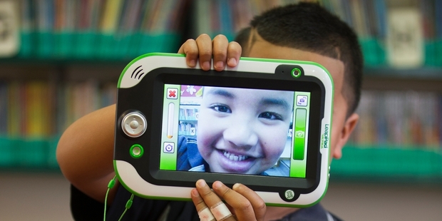 Dux Onelei, 5, with a LeapPad, a digital learning tool that is being used at Colwill Primary in Massey to teach children to write. Photo / Greg Bowker