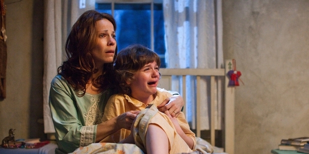 Lili Taylor and Joey King in true-story horror film The Conjuring.