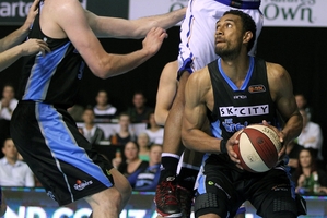 Breakers' forward Mika Vukona looks to shoot around Adelaide's BJ Anthony. Picture / Getty Images