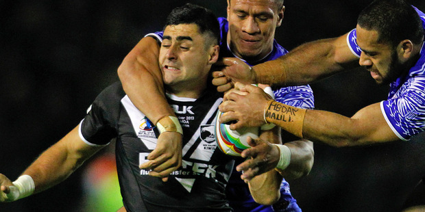 Bryson Goodwin is tackled by Suaia Matagi and Sauaso Sue of Samoa. Photo / Getty Images