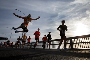 Competitors run over the Auckland Harbour Bridge. Photo / Brett Phibbs