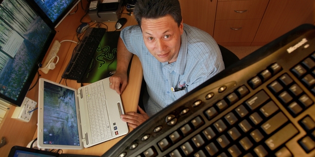 Craig Computers owner Mike Craig is often asked to fix computers after scammers have locked the owners out. Photo / John Borren