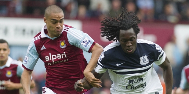 West Ham's Winston Reid, left, fights for the ball with Everton's Romelu Lukaku. Photo / AP