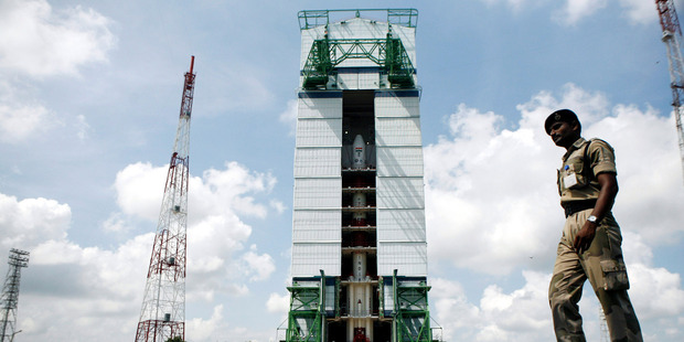 A paramilitary soldier walks past the Polar Satellite Launch Vehicle at the Satish Dhawan Space Center in southern India. Photo / AP