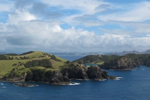 RUBBISH FREE: A barge will collect rubbish from boats and camps at collection sites in the Bay of Islands this summer. Pictured is Waewaetorea Island, with Okahu Island in the distance. PHOTO/PETER DE GRAAF