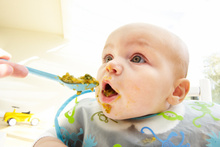 Feeding a baby is messy work.Photo / Thinkstock