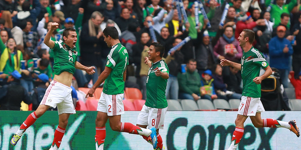 Paul Aguilar of Mexico celebrates with his teammates after their win over the All Whites. Photo / Getty Images