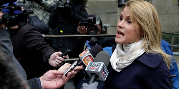 Genevieve Sabourin speaks with reporters outside court. Photo / AP