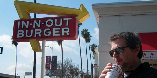 A man enjoying In-N-Out Burger's wares in Los Angeles. Photo / Janie Smith