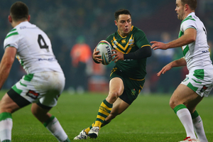 Cooper Cronk (C) of Australiacuts between Liam Finn (R) and Joshua Toole (L) of Ireland during the Rugby League World Cup. Photo / Getty Images.