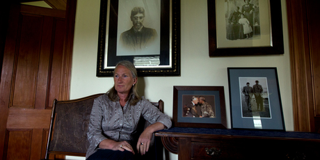 Margaret Kawharu (with family photos at their Reweti homestead). Photo / Brett Phibbs