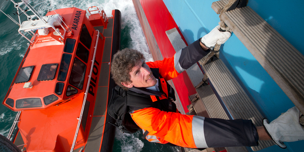 Captain John Barker boards a container ship, for what he says must be the 5000th time. Photo / Richard Robinson
