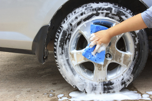 Cleaning the wheel with a sponge