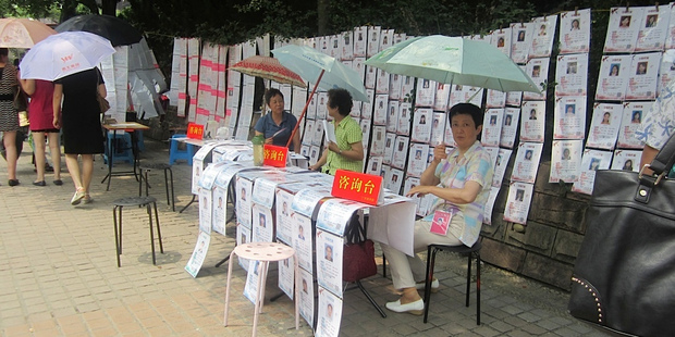 Parents try to find their unmarried children the perfect mate at the Marriage Market in Shanghai's People's Square. Photo / Kirsty Wynn