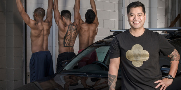 Neil Ieremia with his Audi and some of the Black Grace Dancers. Photo by Ted Baghurst.