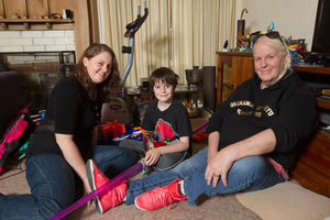 Lexie, right, and Cushla Matheson with their martial arts-mad son Finn, aged 11, at their Auckland home. Photo / Mark Mitchell
