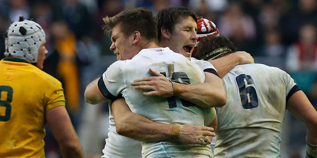 England's Joel Tomkins, center right, and Owen Farrell, center left, celebrate their win against Australia at the end of their autumn international rugby match at Twickenham Stadium in London. Photo / AP