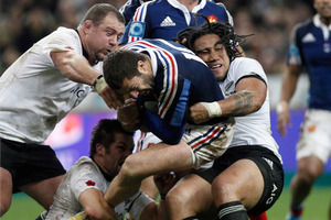 France's Brice Dulin is tackled by New Zealand's All Blacks players during their international rugby match at the Stade de France stadium in Saint Denis. Photo / AP