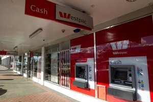 Westpac Pukekohe the scene of an armed robbery where the alleged offenders were involved in a motor vehicle accident on Auckland's Southern Motorway involving a stolen maroon colored BMW getaway car.