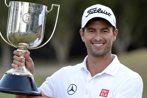 Adam Scott up the Kirkwood Cup as he celebrates victory during day four of the PGA Royal Pines. Photo / Getty Images