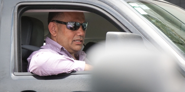 Radio host Willie Jackson drives away from work as he prepares for an early Christmas holiday. Photo / Richard Robinson