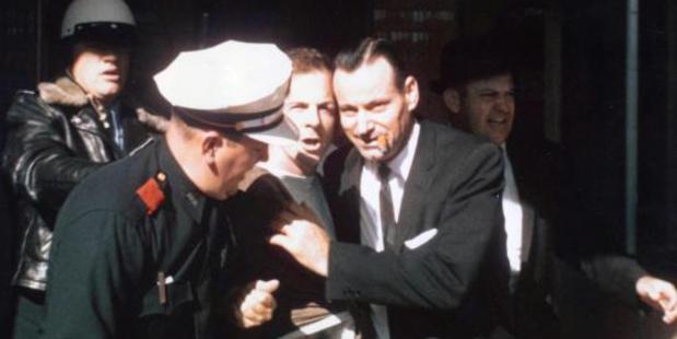 Lee Harvey Oswald is arrested at the Texas Theatre in Dallas, Texas.