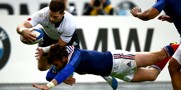 All Black's Cory Jane is tackled out of touch by Maxime Medard of France during the international test match.Photo / Phil Walter