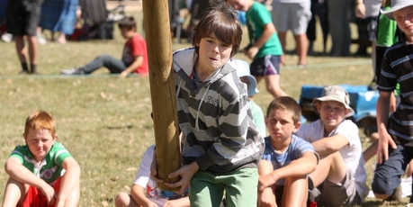 Otis Prescott-Mason takes a turn with the caber at Turakina.