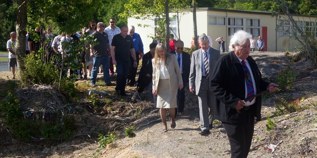 BLESSING: Waiariki Institute of Technology kaumatua Ken Kennedy says a karakia (prayer) while leading the procession of staff, students and construction representatives on the site of a planned $10.2 million health and science building. PHOTO/STEPHEN PARKER 221113SP2