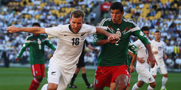 Jeremy Brockie of New Zealand competes with Francisco Javier Rodriguez of Mexico for the ball during leg 2 of the FIFA World Cup Qualifier match. Photo / Getty Images.