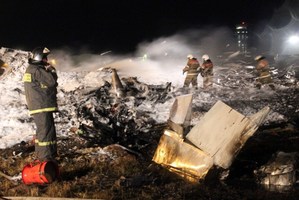 Emergency services working at the site of the plane crash near Kazan. Photo / AFP