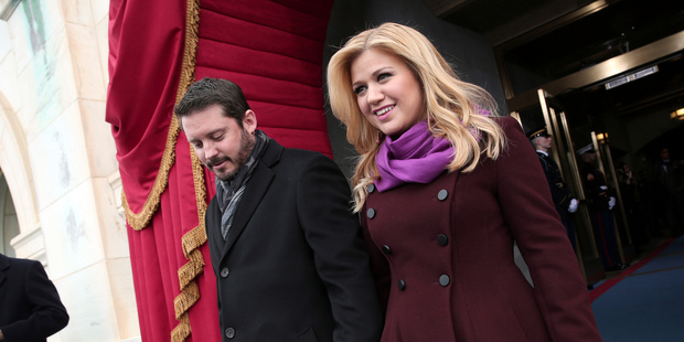 Kelly Clarkson and Brandon Blackstock arrive on the West Front of the Capitol in Washington. Photo / AP