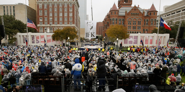 People gather before a ceremony to mark the 50th anniversary of the assassination of John F. Kennedy at Dealey Plaza in Dallas. Photo / AP