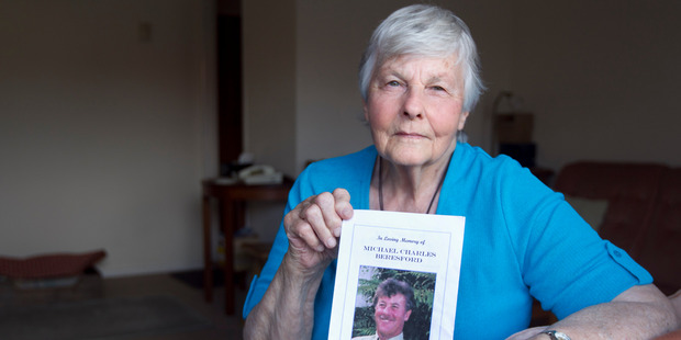 Barbara Beresford with a photo of her son Michael Beresford.