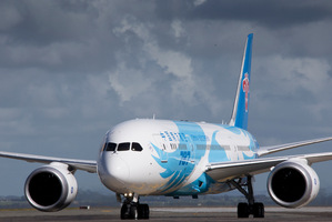 The first commercial Boeing 787 Dreamliner aircraft run by China Southern Airlines lands in Auckland, New Zealand, last month. Photo/Greg Bowker