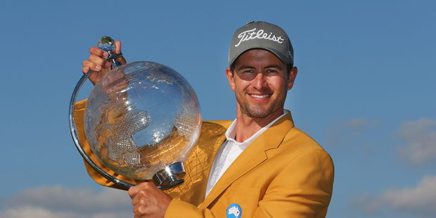Adam Scott holds the trophy aloft after winning the Australian Masters at Royal Melbourne Golf Course. Photo / Getty Images
