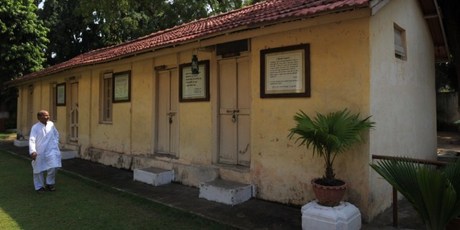 Ashram co-ordinator Rameshbhai Trivedi walks near the kitchen and dining hall hall at Kochrab Ashram. Photo / AFP