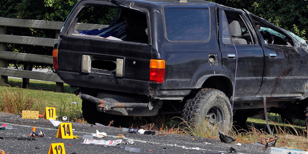 Debris at the fatal car crash scene on the Kaipara Coast Highway included alcohol cans and bottles. Photo / Michael Craig
