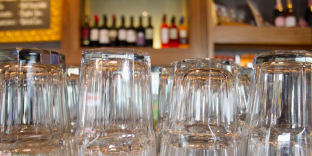 Upturned glasses at a pub counter