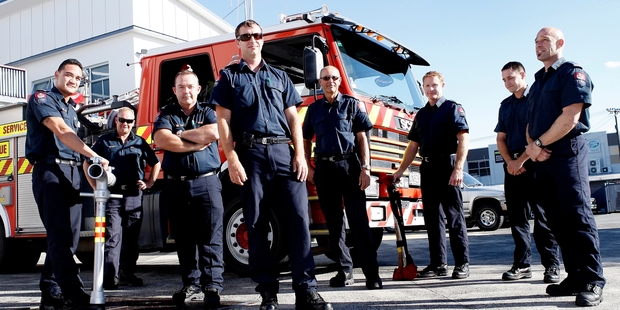 TEAM WORK: Whangarei Fire Service station officer Paul Foster (middle) with fellow firefighters who turned off the gas leak at Kamo after the bus crash. PHOTO/RON BURGIN