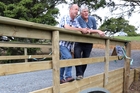 Steve Swann, left, and Kelly Wright on a 4.6m Clearwater Crossings bridge they have installed on John and Bev Manderson's property at Kauri. Photo / John Stone Steve Swann, left, and Kelly Wright on a 4.6m Clearwater Crossings bridge they have installed on John and Bev Manderson's property at Kauri. Photo / John Stone