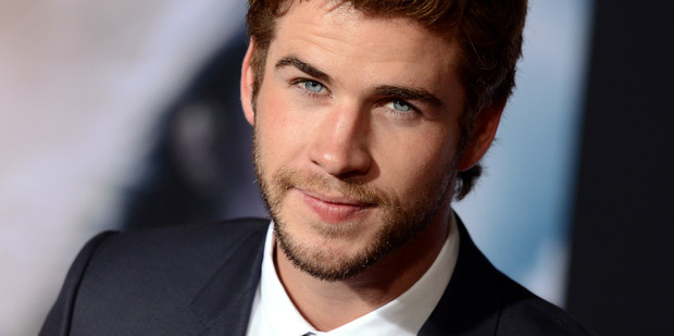 Liam Hemsworth nearly lost the tip of his finger recreating a knife game from his school days. Photo / AP
