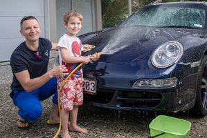 Nic Watt and son Luca wash his Porsche 911 Targa every week. Picture / Ted Baghurst