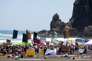People show their opposition to deep sea oil drilling in New Zealand waters at the 'banners on the beach' event at Piha yesterday.